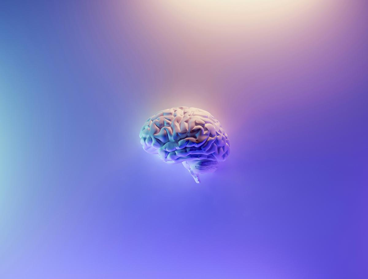 An image showing the concept of BabyAGI, represented by an infant robot with a graphical representation of a brain.