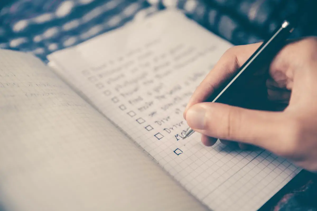 A woman using a computer to manage her task automation list.